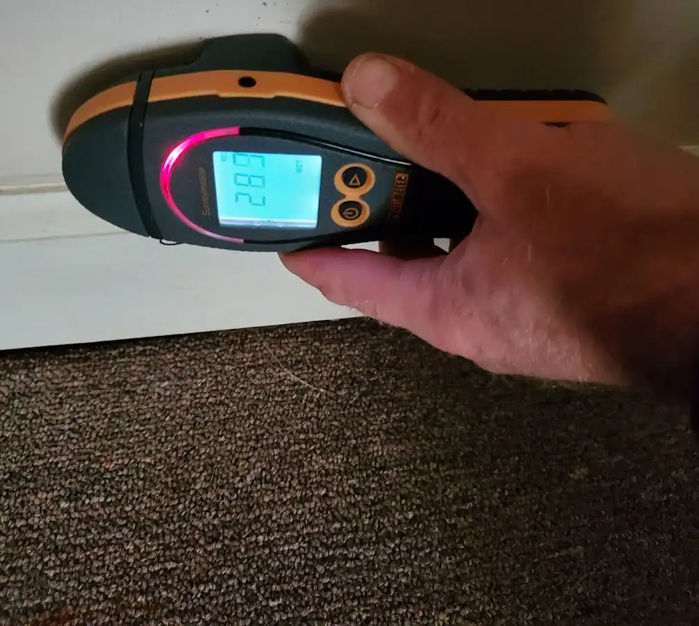 Moisture detection at baseboard during Storm Damage Restoration in East Greenwich